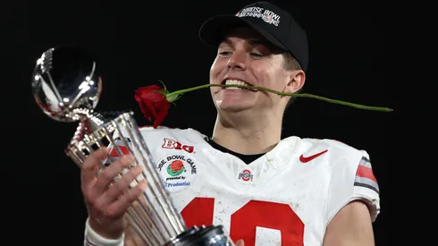 Will Howard #18 of the Ohio State Buckeyes holds the Leishman Trophy after defeating the Oregon Ducks 41-21 in the Rose Bowl Game Presented by Prudential at Rose Bowl Stadium on January 01, 2025 in Pasadena, California.