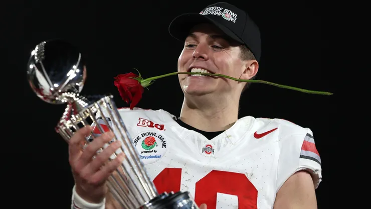 Will Howard #18 of the Ohio State Buckeyes holds the Leishman Trophy after defeating the Oregon Ducks 41-21 in the Rose Bowl Game Presented by Prudential at Rose Bowl Stadium on January 01, 2025 in Pasadena, California.