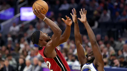Jimmy Butler #22 of the Miami Heat shoots over Draymond Green #23 of the Golden State Warriors at Chase Center on October 27, 2022.