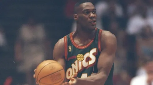 Seattle Supersonics star looks to pass the ball during a game against the Houston Rockets at the Summit in Houston, Texas. The Supersonics won the game 100-94.