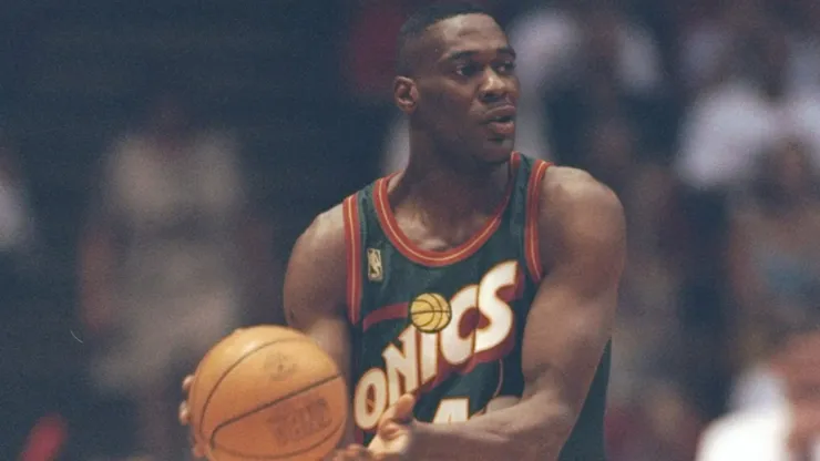 Seattle Supersonics star looks to pass the ball during a game against the Houston Rockets at the Summit in Houston, Texas. The Supersonics won the game 100-94.