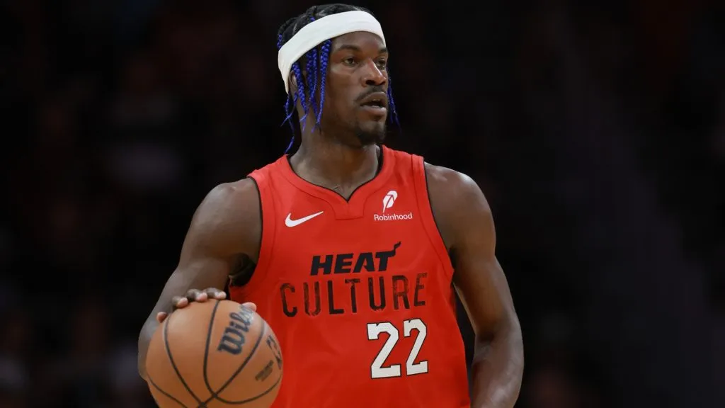 Jimmy Butler #22 of the Miami Heat controls the ball against the Phoenix Suns during the first half at Kaseya Center on December 07, 2024 in Miami, Florida.