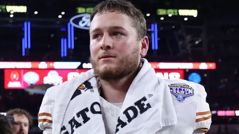 Quinn Ewers #3 of the Texas Longhorns walks off the field after losing to the Ohio State Buckeyes 28-14 in the Goodyear Cotton Bowl at AT&T Stadium on January 10, 2025 in Arlington, Texas.