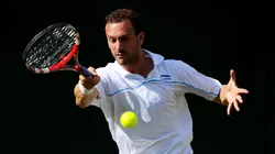 Conor Niland of Ireland returns a shot during his first round match against Adrian Mannarino of France on Day Two of the Wimbledon Lawn Tennis Championships at the All England Lawn Tennis and Croquet Club on June 21, 2011 in London, England.