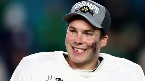 Riley Leonard #13 of the Notre Dame Fighting Irish celebrates after defeating the Penn State Nittany Lions 27-24 in the Capital One Orange Bowl at Hard Rock Stadium on January 09, 2025 in Miami Gardens, Florida.