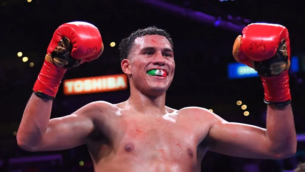 David Benavidez (red/green trunks) reacts after defeating Anthony Dirrell (not in frame) after a corner stoppage in their WBC Super Middleweight Championship fight at Staples Center on September 28, 2019 in Los Angeles, California. (Photo by Jayne Kamin-Oncea/Getty Images)