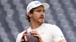 Justin Herbert of the Los Angeles Chargers warms up prior to a game against the Houston Texans during the AFC Wild Card Playoffs.