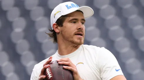 Justin Herbert of the Los Angeles Chargers warms up prior to a game against the Houston Texans during the AFC Wild Card Playoffs.