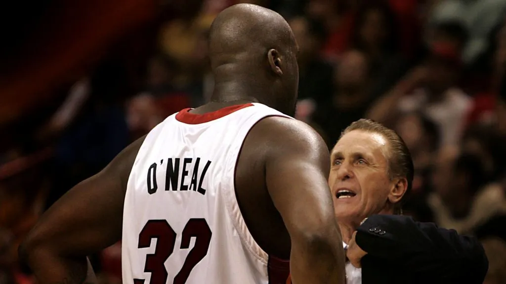 Head Coach Pat Riley of the Miami Heat chats with Shaquille O’Neal #32 during a break in the action against the Los Angeles Lakers on December 25, 2005.
