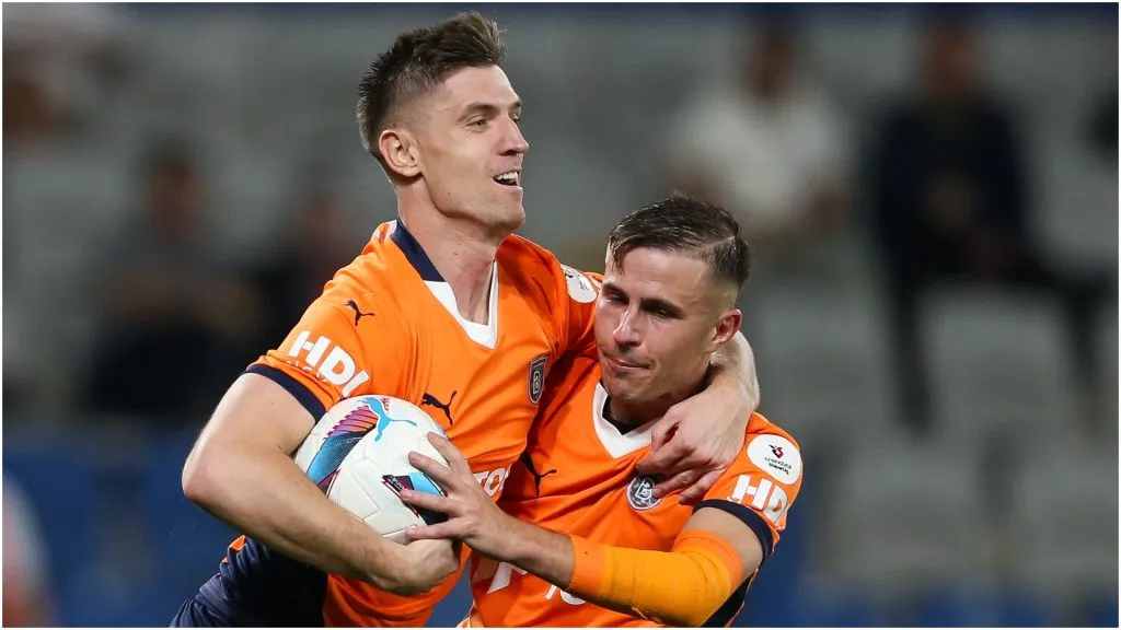 Krzysztof Piatek of Basaksehir celebrates with his teammate Dimitrios Pelkas – Ahmad Mora/Getty Images