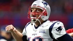 Tom Brady #12 of the New England Patriots pumps his fist running onto the field before Super Bowl LIII against the Los Angeles Rams at Mercedes-Benz Stadium on February 03, 2019 in Atlanta, Georgia.
