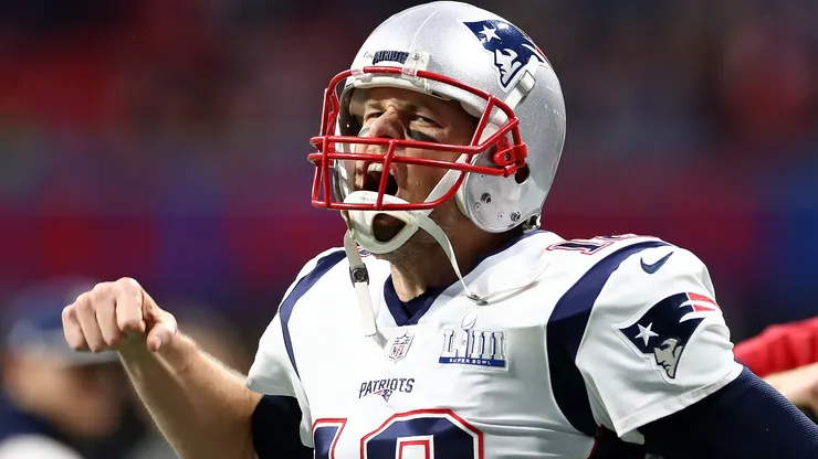 Tom Brady #12 of the New England Patriots pumps his fist running onto the field before Super Bowl LIII against the Los Angeles Rams at Mercedes-Benz Stadium on February 03, 2019 in Atlanta, Georgia.