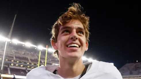 Arch Manning #16 of the Texas Longhorns celebrates after the game against the Texas A&M Aggies at Kyle Field on November 30, 2024 in College Station, Texas.