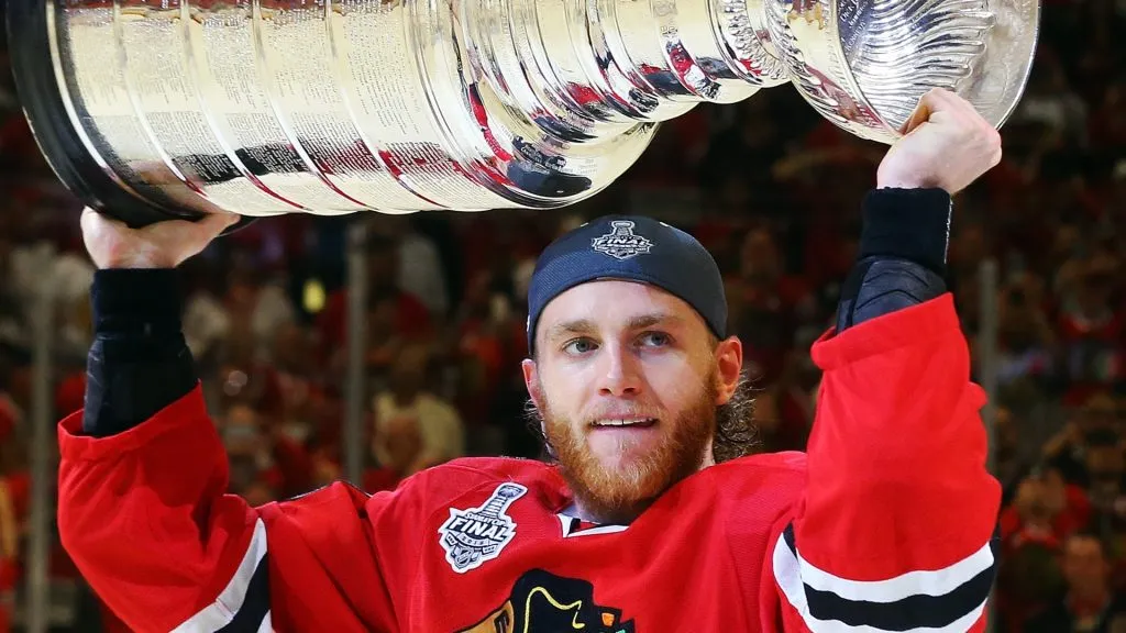 Patrick Kane #88 of the Chicago Blackhawks celebrates by hoisting the Stanley Cup after defeating the Tampa Bay Lightning by a score of 2-0 in Game Six to win the 2015 NHL Stanley Cup Final at the United Center on June 15, 2015 in Chicago, Illinois.