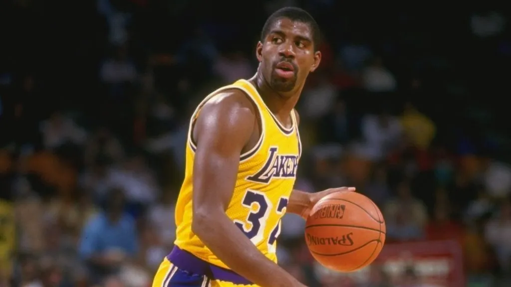 Guard Magic Johnson of the Los Angeles Lakers dribbles the ball during a game at the Great Western Forum in 1987. (Source: Stephen Dunn /Allsport)