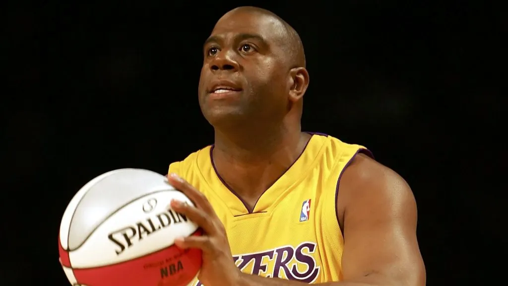 Magic Johnson of the Los Angeles team gets ready to shoot in the Radio Shack Shooting Stars competition during NBA All-Star Weekend at the Toyota Center on February 18, 2006. (Source: Lisa Blumenfeld/Getty Images)