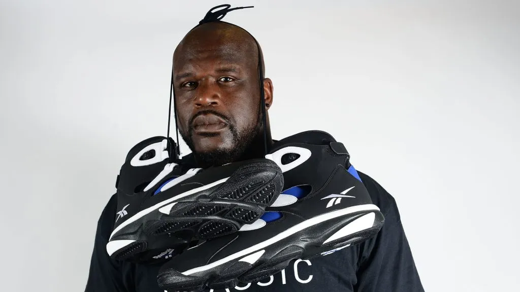 Former NBA basketball player Shaquille O’Neal poses with Reebok sneakers at the Reebok Classic Breakout at Philadelphia University on July 9, 2014. (Source: Lisa Lake/Getty Images for Reebok)