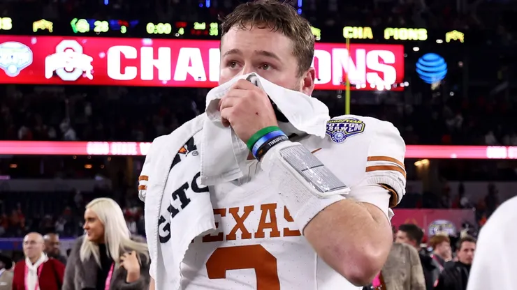 Quinn Ewers #3 of the Texas Longhorns walks off the field after losing to the Ohio State Buckeyes 28-14 in the Goodyear Cotton Bowl at AT&T Stadium on January 10, 2025 in Arlington, Texas.