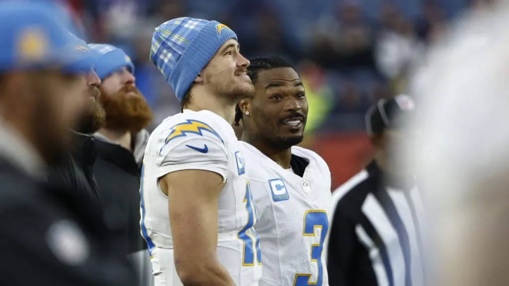 Justin Herbert #10 and Derwin James Jr. #3 of the Los Angeles Chargers