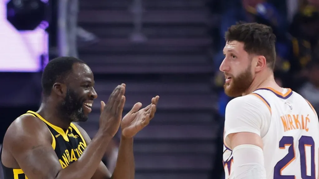 Draymond Green #23 of the Golden State Warriors reacts after being fouled by Jusuf Nurkic #20 of the Phoenix Suns
