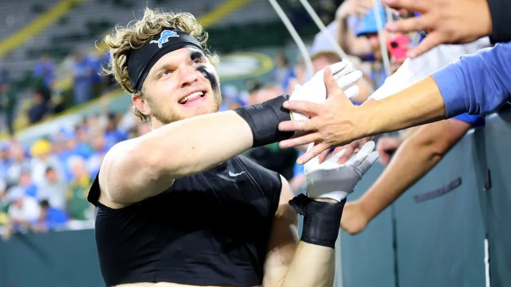 Aidan Hutchinson #97 of the Detroit Lions celebrates with fans after defeating the Green Bay Packers in the game at Lambeau Field on September 28, 2023. (Source: Stacy Revere/Getty Images)