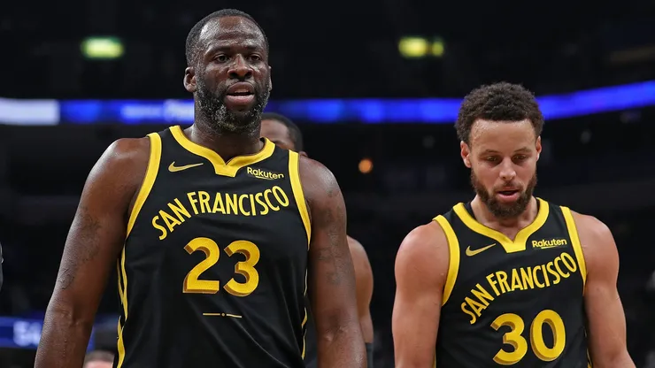 Draymond Green #23 of the Golden State Warriors and Stephen Curry #30 of the Golden State Warriors walk off the court.