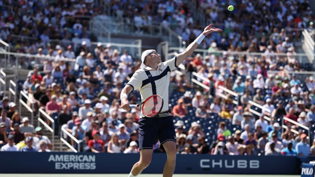 John Isner of the United States serves in a final career match loss against Michael Mmoh during the 2023 US Open. (Al Bello/Getty Images)
