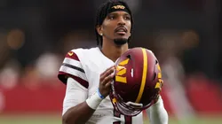 Jayden Daniels #5 of the Washington Commanders looks on during the second half against the Arizona Cardinals at State Farm Stadium on September 29, 2024.