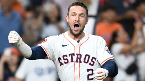 Alex Bregman #2 of the Houston Astros tosses his helmet and celebrates after hitting the game-winning home run in the ninth inning beating the Los Angeles Dodgers by a score of 7-6 at Minute Maid Park on July 27, 2024 in Houston, Texas.