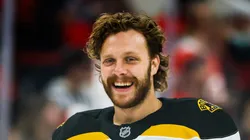 David Pastrnak #88 of the Boston Bruins smiles during warmups of the game against the Carolina Hurricanes at Lenovo Center on October 31, 2024 in Raleigh, North Carolina.