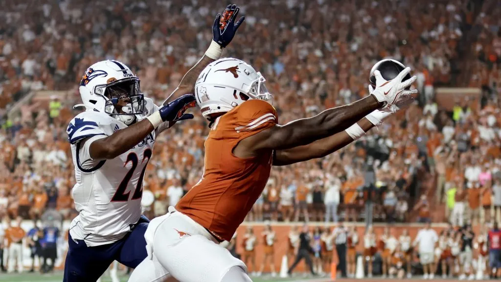 Johntay Cook II #1 of the Texas Longhorns catches a pass for a touchdown while defended by Elijah Newell #22 of the UTSA Roadrunners in the second half at Darrell K Royal-Texas Memorial Stadium on September 14, 2024 in Austin, Texas.
