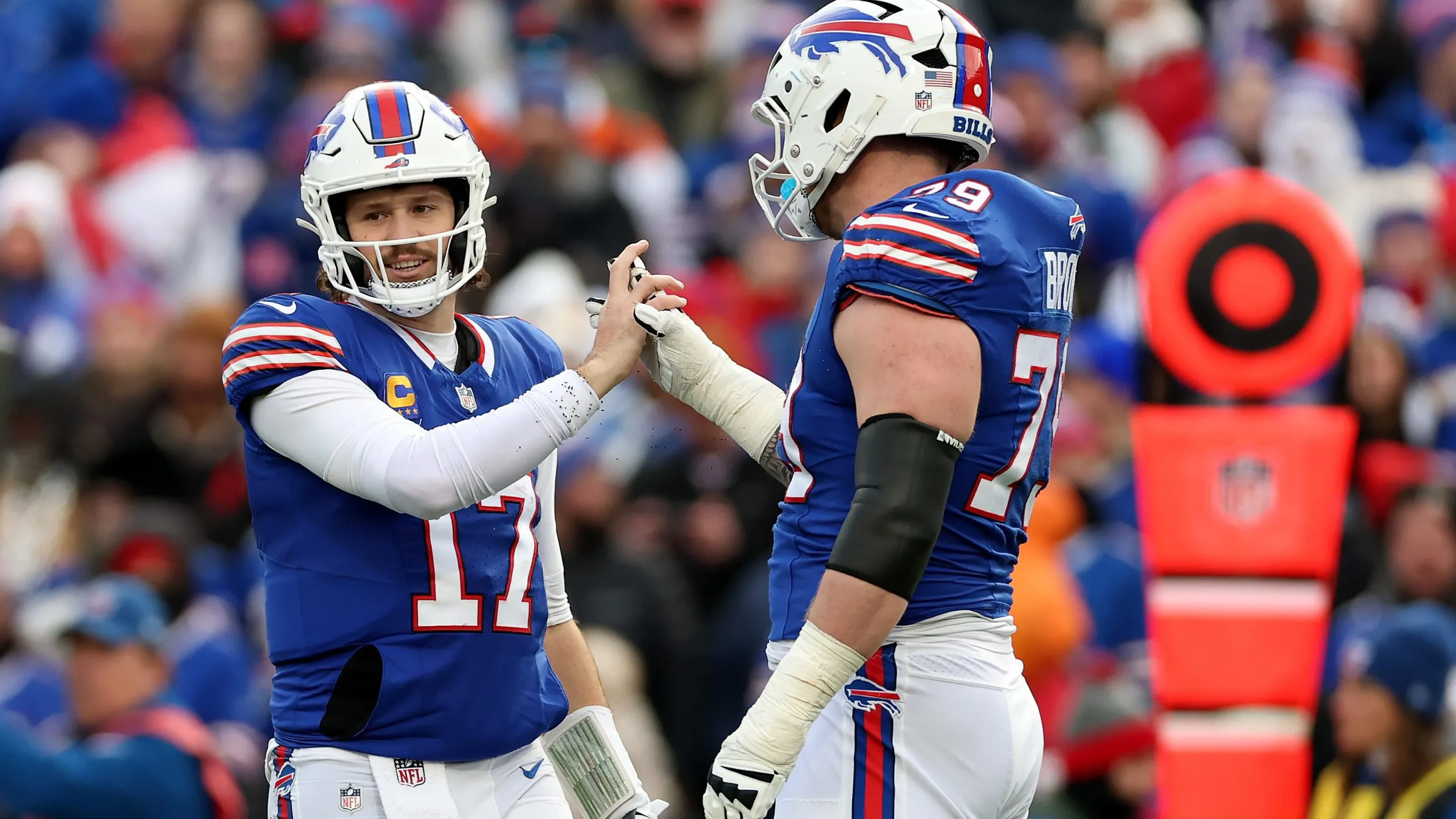 Josh Allen #17 and Spencer Brown #79 of the Buffalo Bills