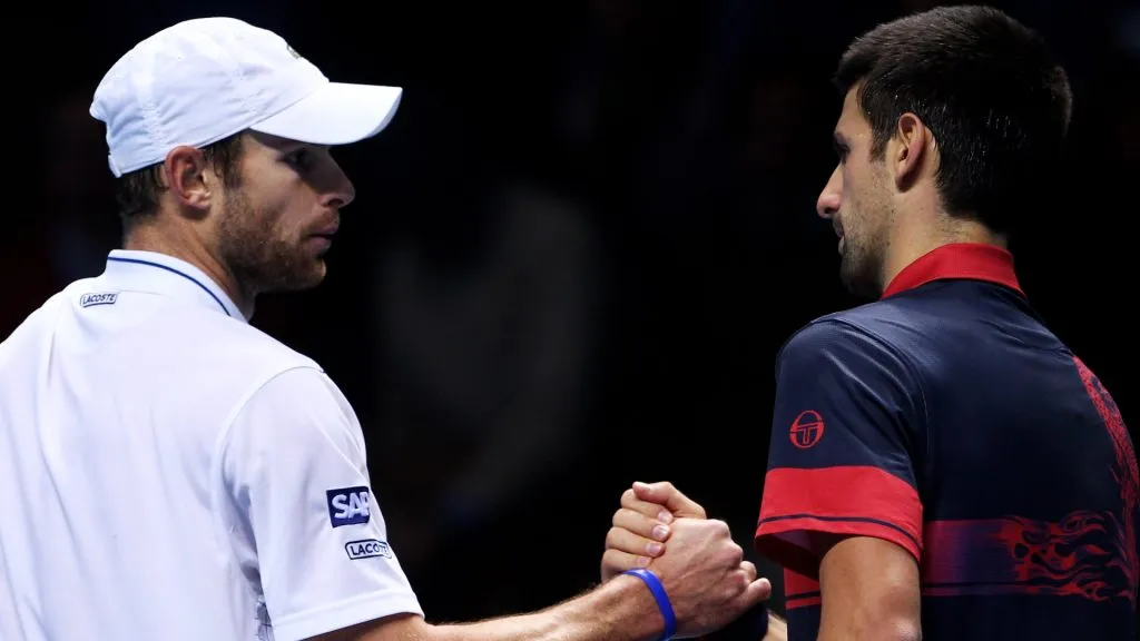 Novak Djokovic of Serbia (R) shakes hands with Andy Roddick of the USA (L) after winning his men’s singles match during the ATP World Tour Finals. (Julian Finney/Getty Images)