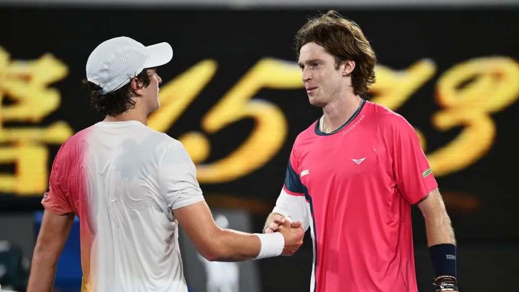 Joao Fonseca of Brazil shakes hands with Andrey Rublev following victory in the Men’s Singles First Round match during the 2025 Australian Open. (Hannah Peters/Getty Images)