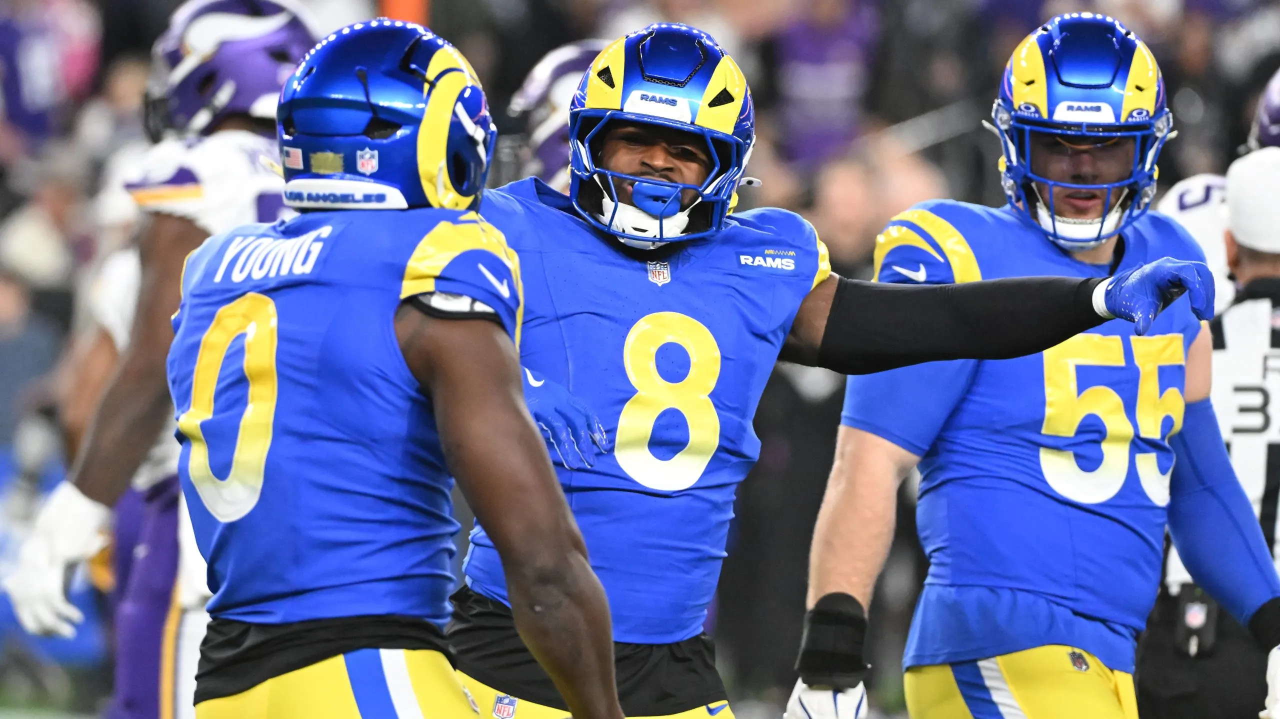 Byron Young #0 and Jared Verse #8 of the Los Angeles Rams