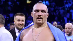 Oleksandr Usyk celebrates with their belts after their victory over Anthony Joshua in their World Heavyweight Championship fight during the Rage on the Red Sea Heavyweight Title Fight at King Abdullah Sports City Arena on August 20, 2022 in Jeddah, Saudi Arabia.