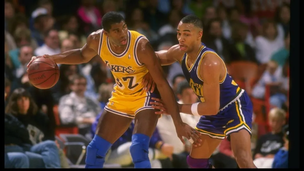 Guard Earvin (Magic) Johnson of the Los Angeles Lakers moves the ball during an NBA game against the Utah Jazz. (Getty Images)