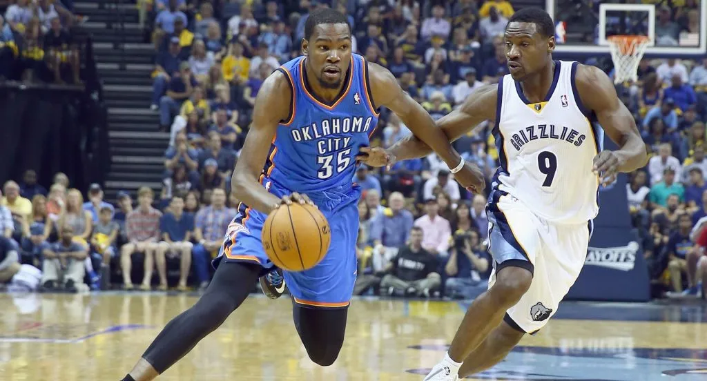 Kevin Durant #35 of the Oklahoma City Thunder dribbles the ball while defended by Tony Allen #9 of the Memphis Grizzlies on April 26, 2014 in Memphis, Tennessee.