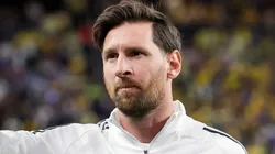 Lionel Messi of Inter Miami waves to fans during warmups before a preseason friendly match against America