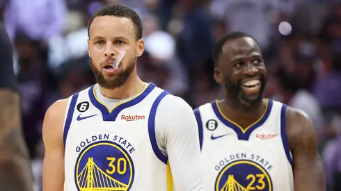 Stephen Curry #30 of the Golden State Warriors and Draymond Green #23 react during the fourth quarter in game seven of the Western Conference First Round Playoffs against the Sacramento Kings.