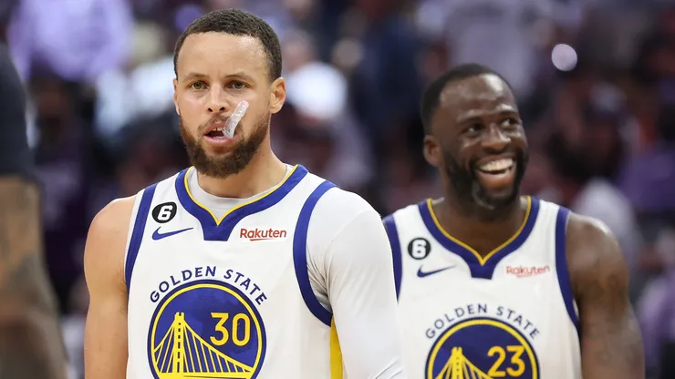 Stephen Curry #30 of the Golden State Warriors and Draymond Green #23 react during the fourth quarter in game seven of the Western Conference First Round Playoffs against the Sacramento Kings.