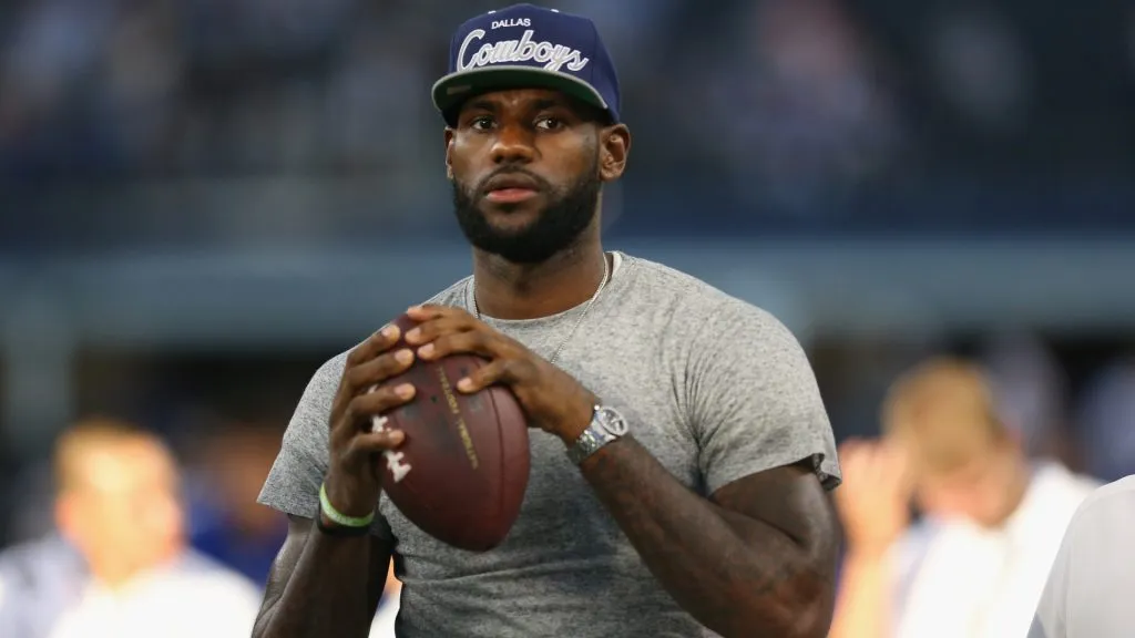 Lebron James of the Miami Heat throws a football at AT&amp;T Stadium before a Sunday night game between the New York Giants and the Dallas Cowboys in 2013. (Ronald Martinez/Getty Images)
