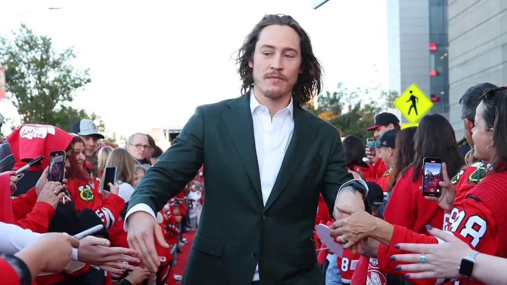Tyler Bertuzzi #59 of the Chicago Blackhawks arrives to the red carpet prior to the Chicago Blackhawks home opener against the San Jose Sharks at the United Center on October 17, 2024 in Chicago, Illinois.