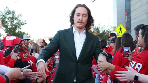 Tyler Bertuzzi #59 of the Chicago Blackhawks arrives to the red carpet prior to the Chicago Blackhawks home opener against the San Jose Sharks at the United Center on October 17, 2024 in Chicago, Illinois.