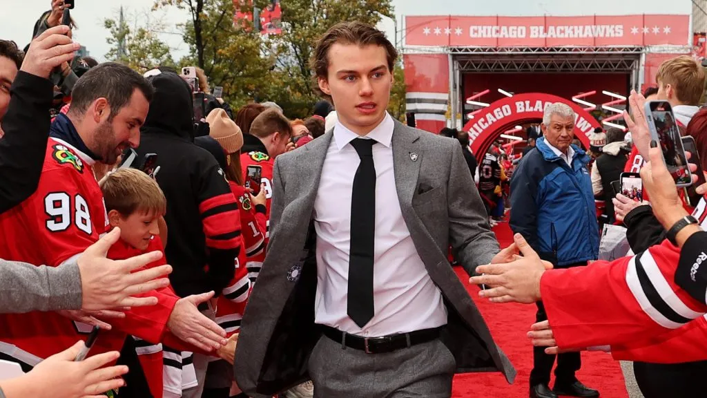 Connor Bedard #98 of the Chicago Blackhawks arrives to the red carpet prior to the game against the Vegas Golden Knights at the United Center on October 21, 2023 in Chicago, Illinois.