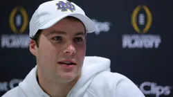 Riley Leonard #13 of the Notre Dame Fighting Irish speaks to the media during the Notre Dame Fighting Irish media day at the Georgia World Congress Center prior to the 2025 CFP National Championship between the Ohio State Buckeyes and Notre Dame Fighting Irish on January 18, 2025 in Atlanta, Georgia.