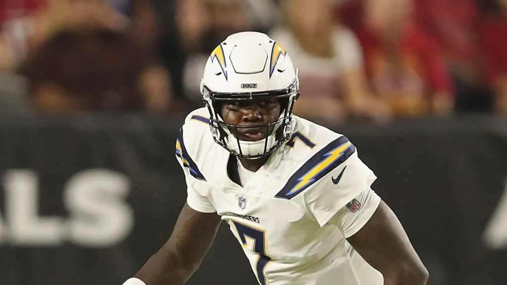 Quarterback Cardale Jones #7 of the Los Angeles Chargers scrambles with the football against the Arizona Cardinals during the preseason NFL game at University of Phoenix Stadium on August 11, 2018 in Glendale, Arizona.
