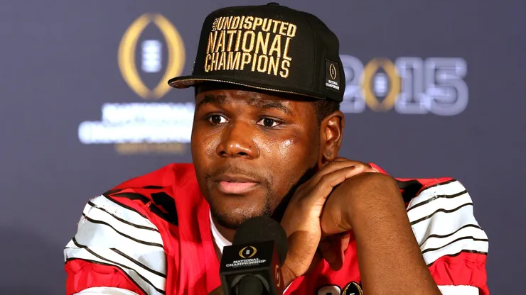 Quarterback Cardale Jones #12 of the Ohio State Buckeyes talks to the media after defeating the Oregon Ducks in the College Football Playoff National Championship Game at AT&T Stadium on January 12, 2015 in Arlington, Texas. The Ohio State Buckeyes defeated the Oregon Ducks 42 to 20.