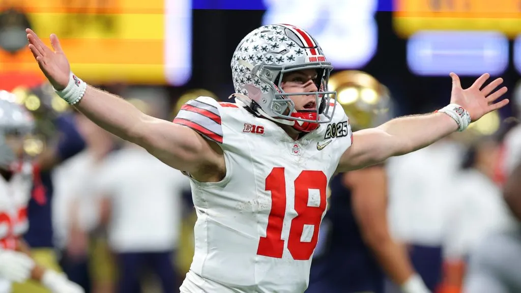 Will Howard #18 of the Ohio State Buckeyes reacts after throwing a pass for a first down against the Notre Dame Fighting Irish during the fourth quarter in the 2025 CFP National Championship at the Mercedes-Benz Stadium on January 20, 2025 in Atlanta, Georgia.