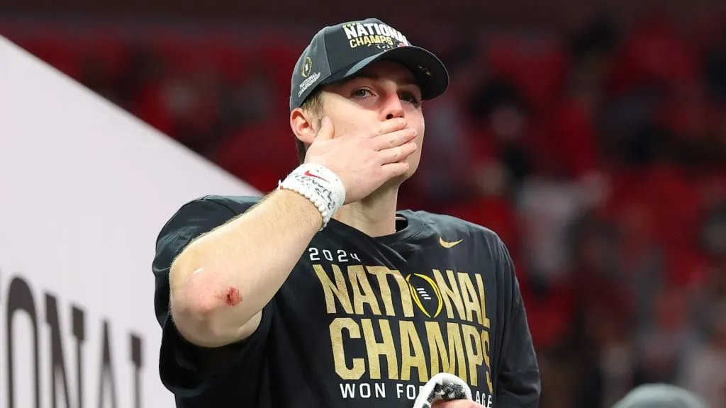 Will Howard #18 of the Ohio State Buckeyes celebrates after beating the Notre Dame Fighting Irish 34-23 in the 2025 CFP National Championship at the Mercedes-Benz Stadium on January 20, 2025 in Atlanta, Georgia.